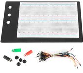 Placa de pruebas sin soldadura de 1660 puntos con 65 cables de puente y 3 postes de conexión para crear prototipos de circuitos.