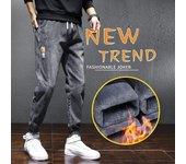 Otoño e Invierno nuevos pantalones vaqueros gruesos de felpa para hombres pantalones largos casuales sueltos de moda 2XL negro