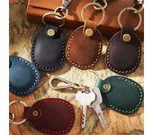 Estuche protector de cuero AirTag con llavero y tarjetero disponible AirTag rojo vino