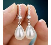 Pendientes colgantes de perlas de imitación de gota de agua de Color plateado a la moda para mujer, pendientes redondos brillantes elegantes con pasador de perlas de imitación 1