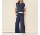 2025 Tendencia de verano Traje casual Contraste de tres mangas Top Pantalones de siete puntos Conjunto de dos piezas Mujeres