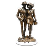 Rotatable acrylic sculpture of an African American couple in stylish beige and black attire on a wooden base with a round top