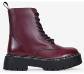 Bosanova Botas militares para mujer estilo punk confeccionadas en piel vegana con plataforma dentada y cordones hasta la parte superior. Cierre con cremallera.