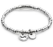 Pulsera con colgante de la suerte, ideal como regalo para parejas.